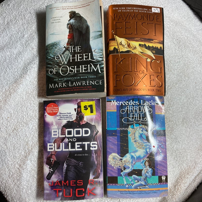 4 Paperback novels: The Wheel of Osheim, King of Foxes, Blood& Bullets and Arrows Fall #38 