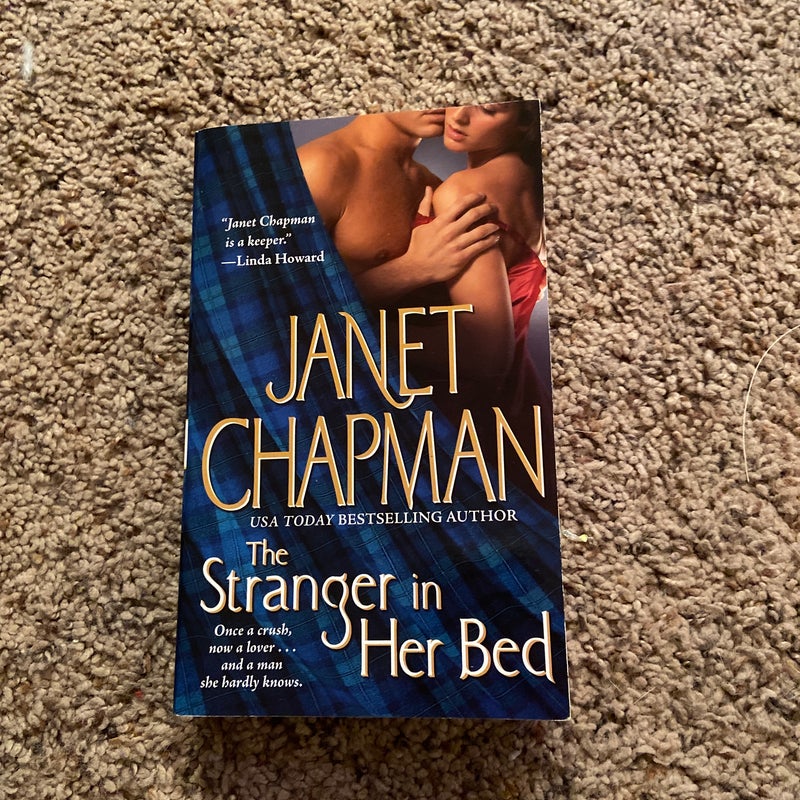 The Stranger in Her Bed