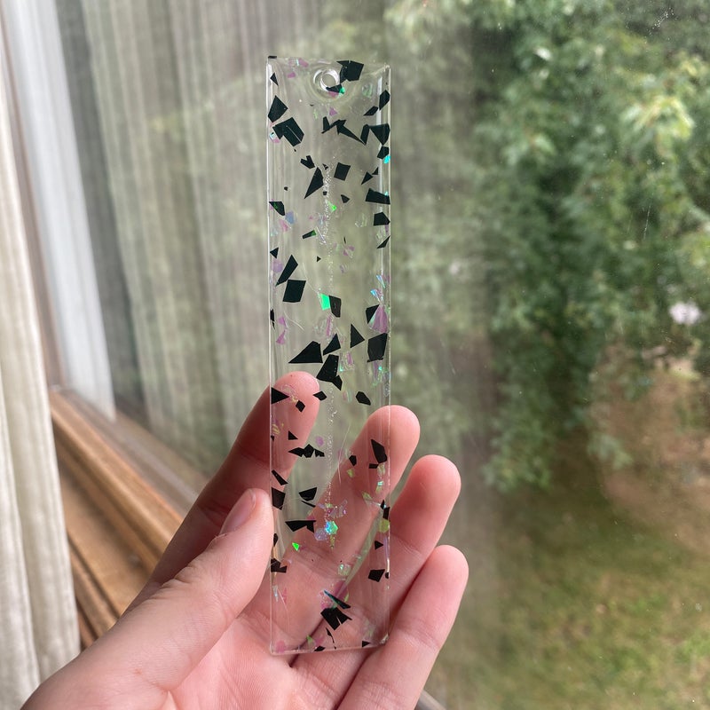 5.55” by 1.81” black and white foil resin bookmark