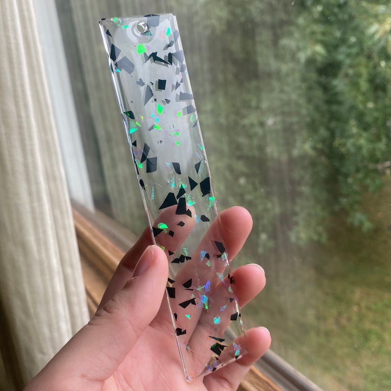 5.55” by 1.81” black and white foil resin bookmark