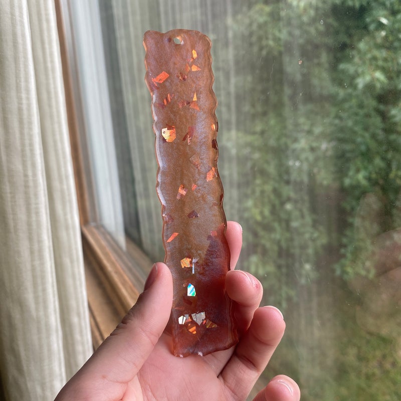 5.55” by 1.81” silver foil with color change resin bookmark