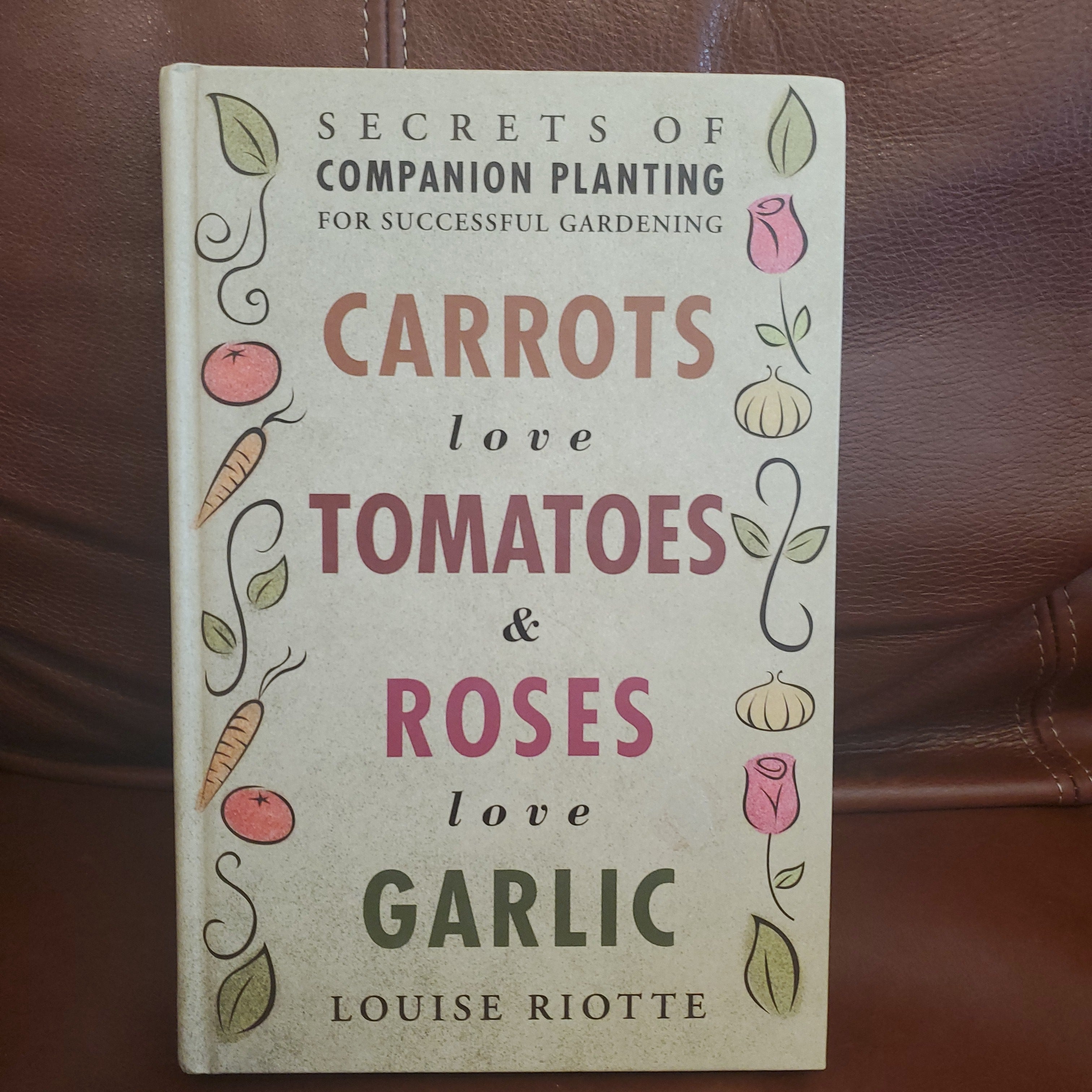 Carrots Love Tomatoes and Roses Love Garlic