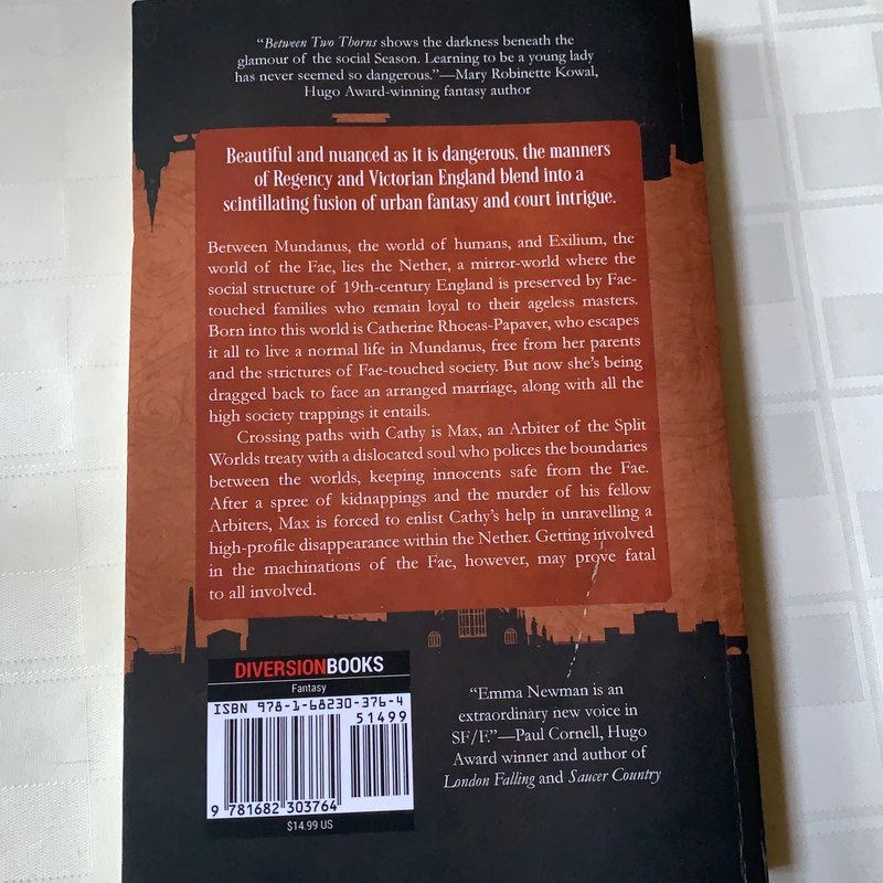 Between Two Thorns by Emma Newman, Paperback | Pangobooks