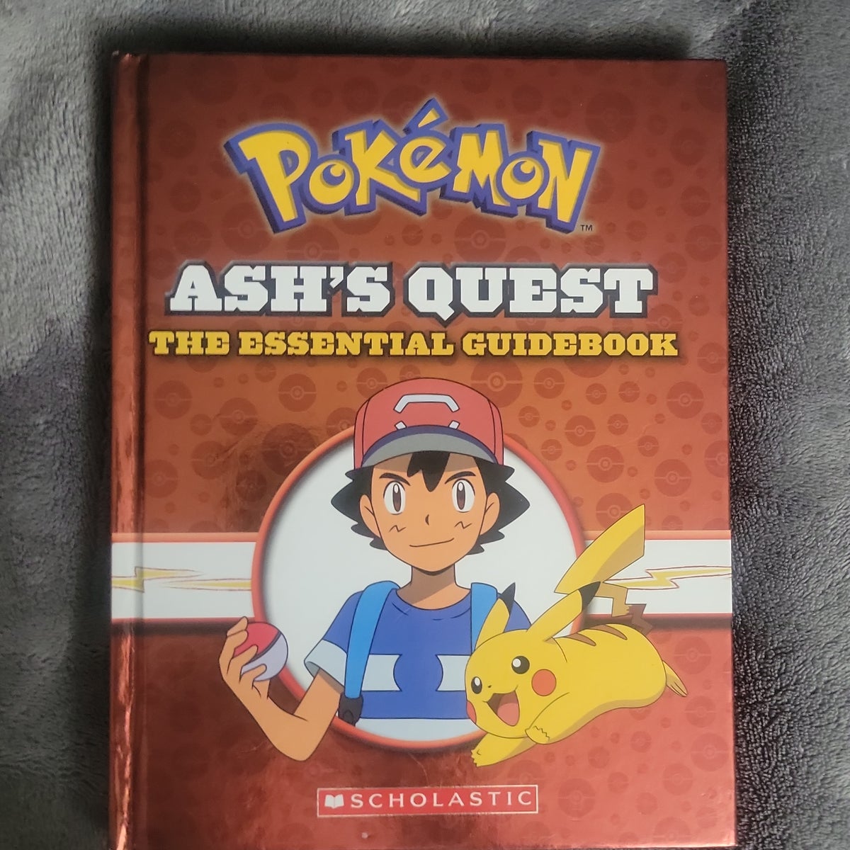 Ash's Quest: The Essential Guidebook (Pokémon): Ash's Quest from Kanto to  Alola (Hardcover)