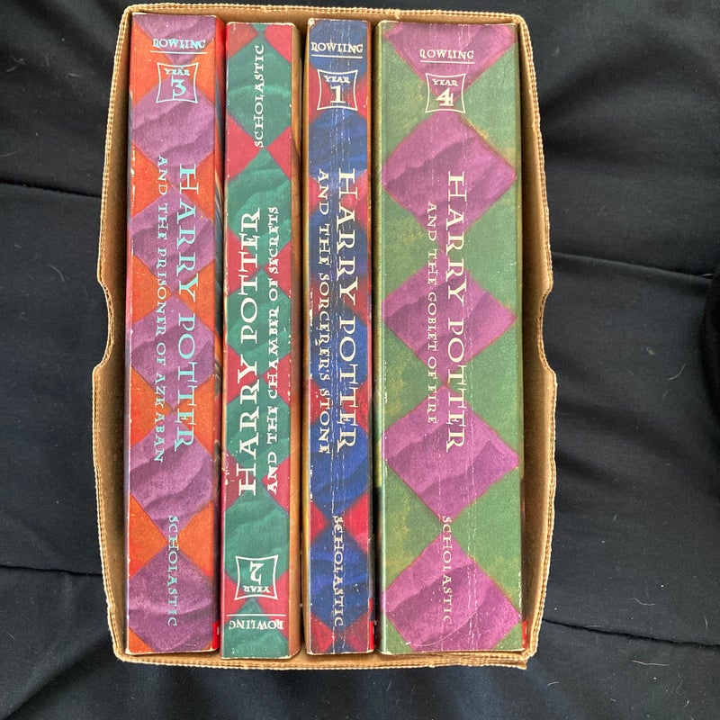 Boxed Set Harry Potter Paperback  (Books 1-4) Scholastic copyright  1999