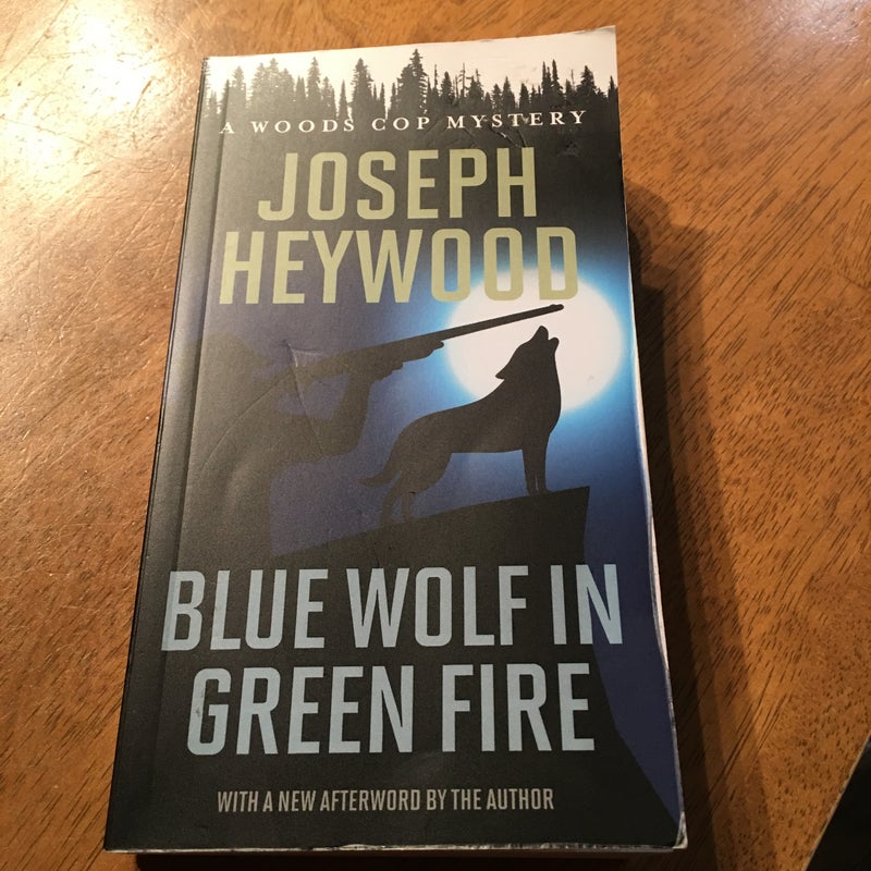 Blue Wolf in Green Fire (A Woods Cop Mystery)