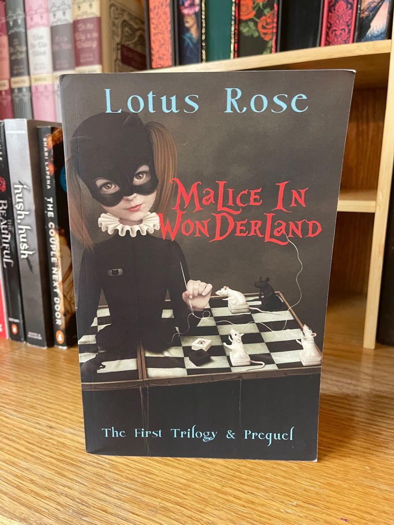 Malice in Wonderland: the First Trilogy and Prequel