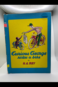 Curious George Rides a Bike