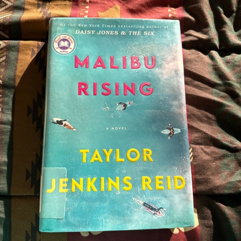 Malibu Rising ( Ex- library book with stamps)