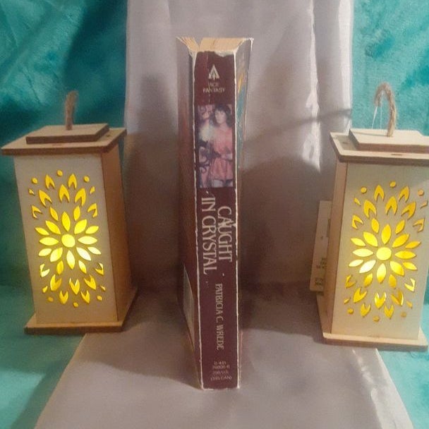 Caught in Crystal : A Lyra Novel by Patricia C. Wrede