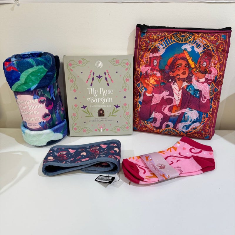 Fairyloot Item Bundle: Daughter of the Moon Goddess blanket, Once Upon a Broken Heart socks, A Tempest of Tea book sleeve, A Language of Dragons headband, and The Rose Bargain embroidery kit