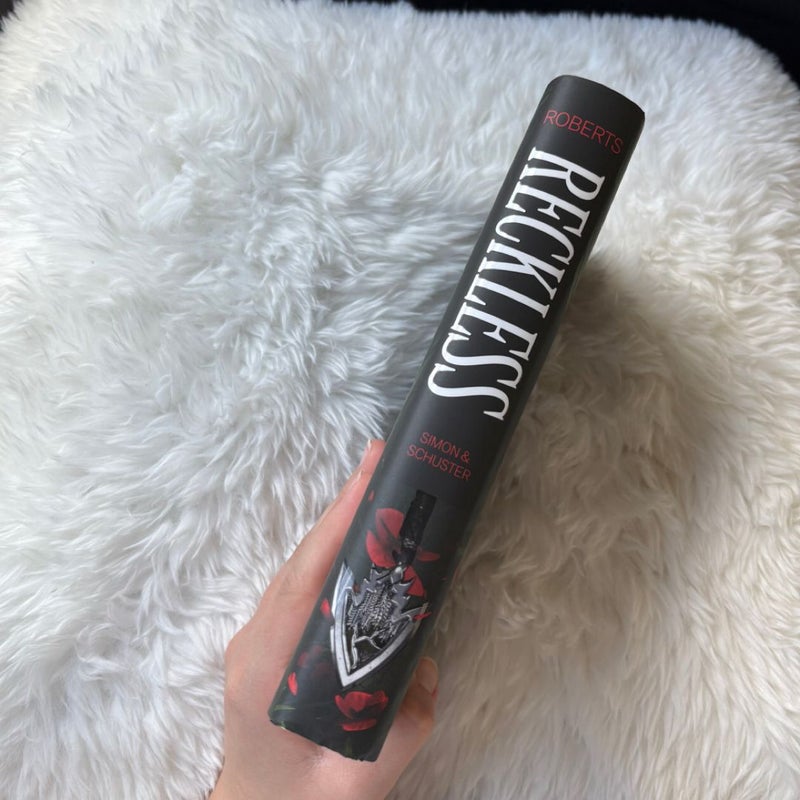 Two Hardback Books: Powerless + Reckless