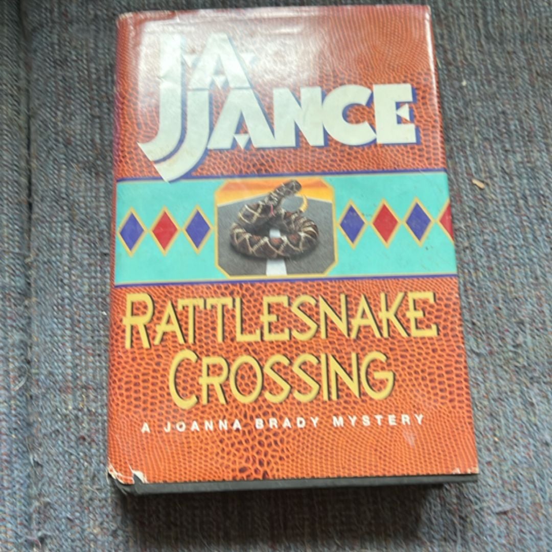 A Young Eastern Diamondback Rattlesnake Crossing A Sand Road Stock Photo