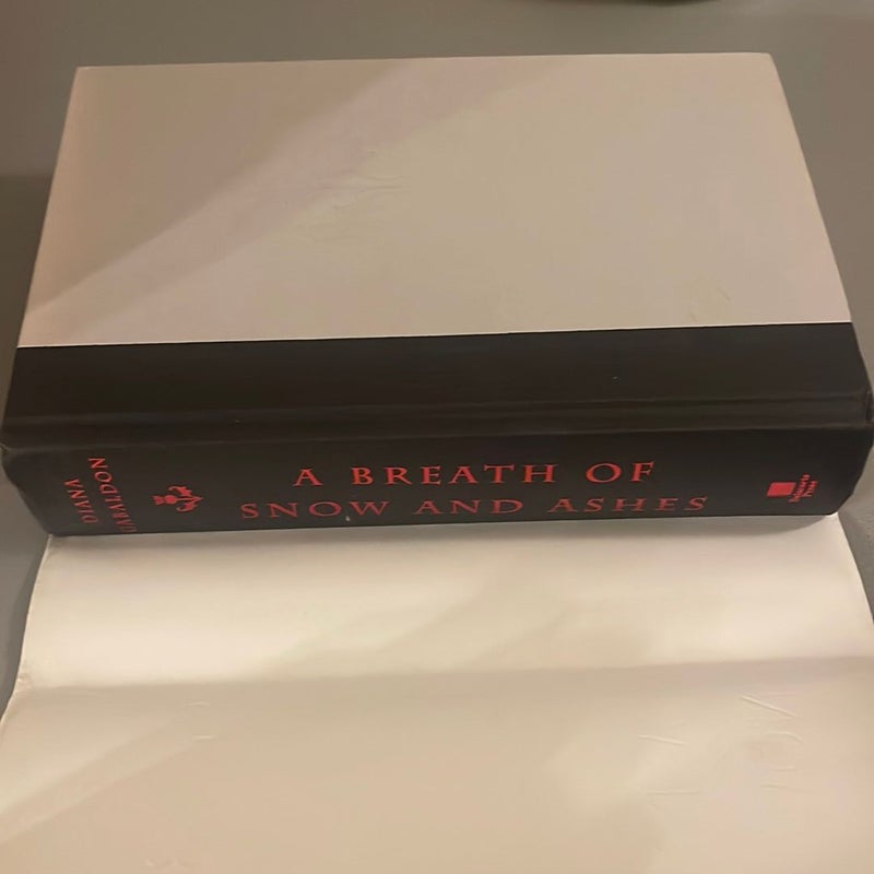A Breath of Snow and Ashes (signed 1st edition)