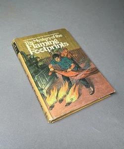 Alfred Hitchcock and the Three Investigators in The Mystery of the Flaming Footprints  