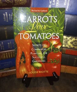 Carrots Love Tomatoes and Roses Love Garlic