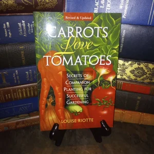 Carrots Love Tomatoes and Roses Love Garlic