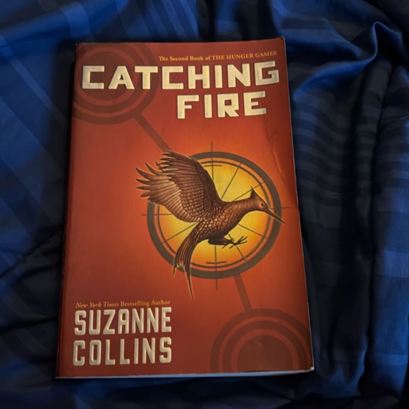 Catching Fire by Suzanne Collins, Paperback | Pangobooks