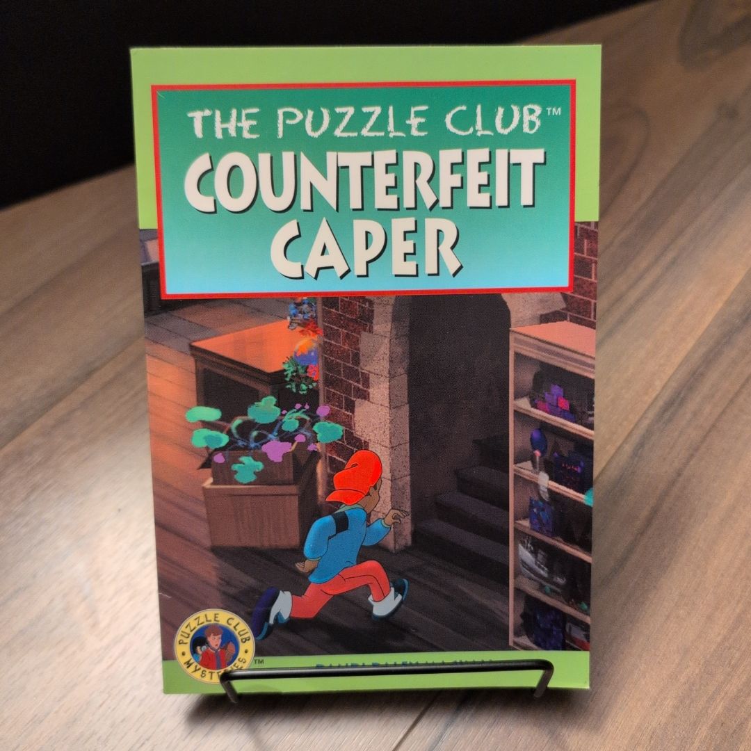 The Puzzle Club™ Counterfeit Capee