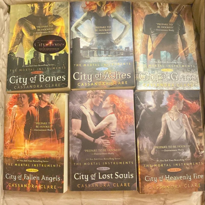 City of Bones/City of Ashes/City of Glass/City of Fallen Angels/City of Lost Souls/City of Heavenly Fire