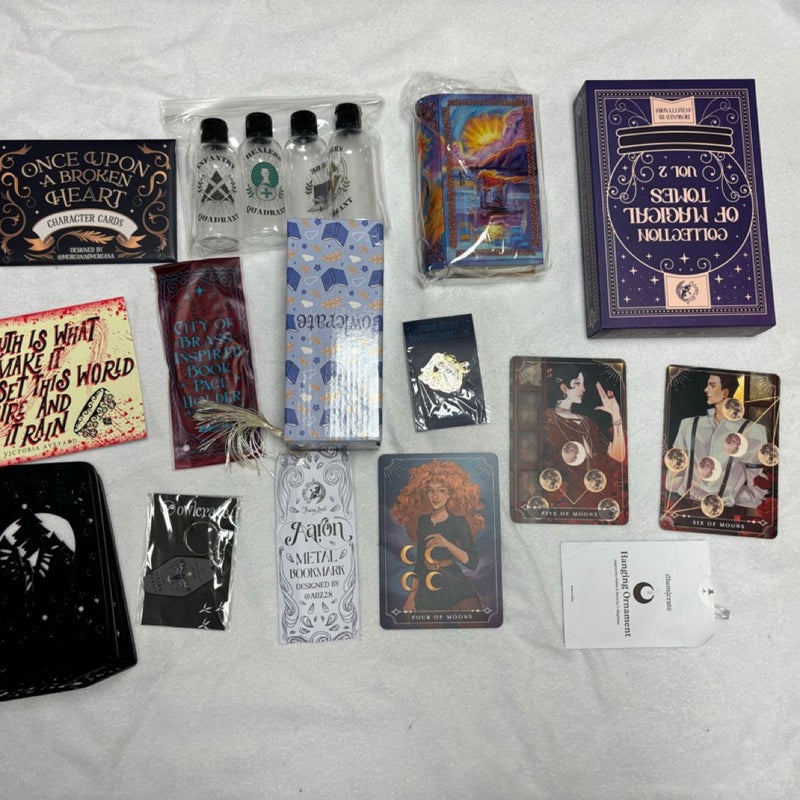 Box with 15 books and 20 goodies from Bookish box, Illumicrate, Fairyloot, Faecrate and Owlcrate.