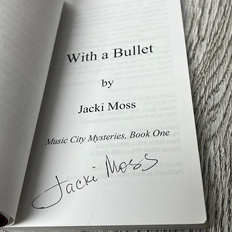 With a Bullet (Signed Copy)