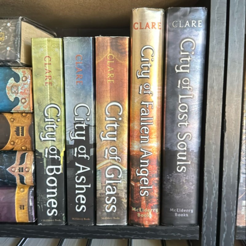 City of Bones, City of Ashes, City of Glass, City of Fallen Angels, AND City of Lost Souls