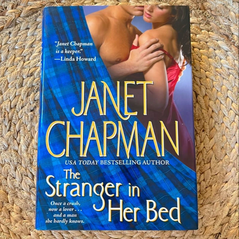 The Stranger in Her Bed