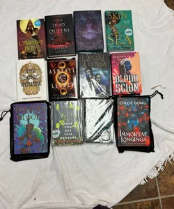Box with 12 books and 16 goodies from Bookish box, Illumicrate, Fairyloot, Faecrate and Owlcrate.  