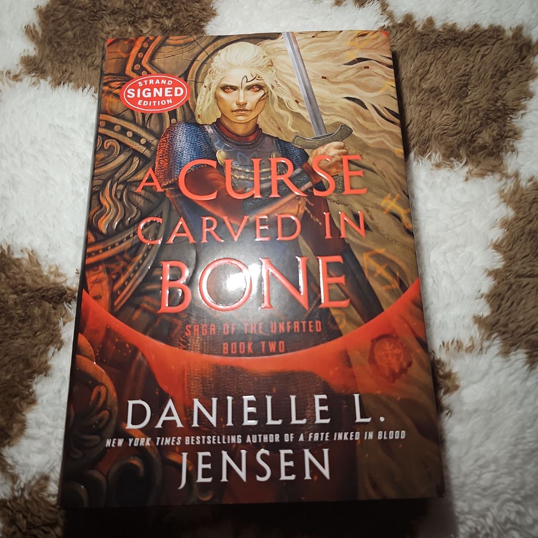 SIGNED A Curse Carved in Bone