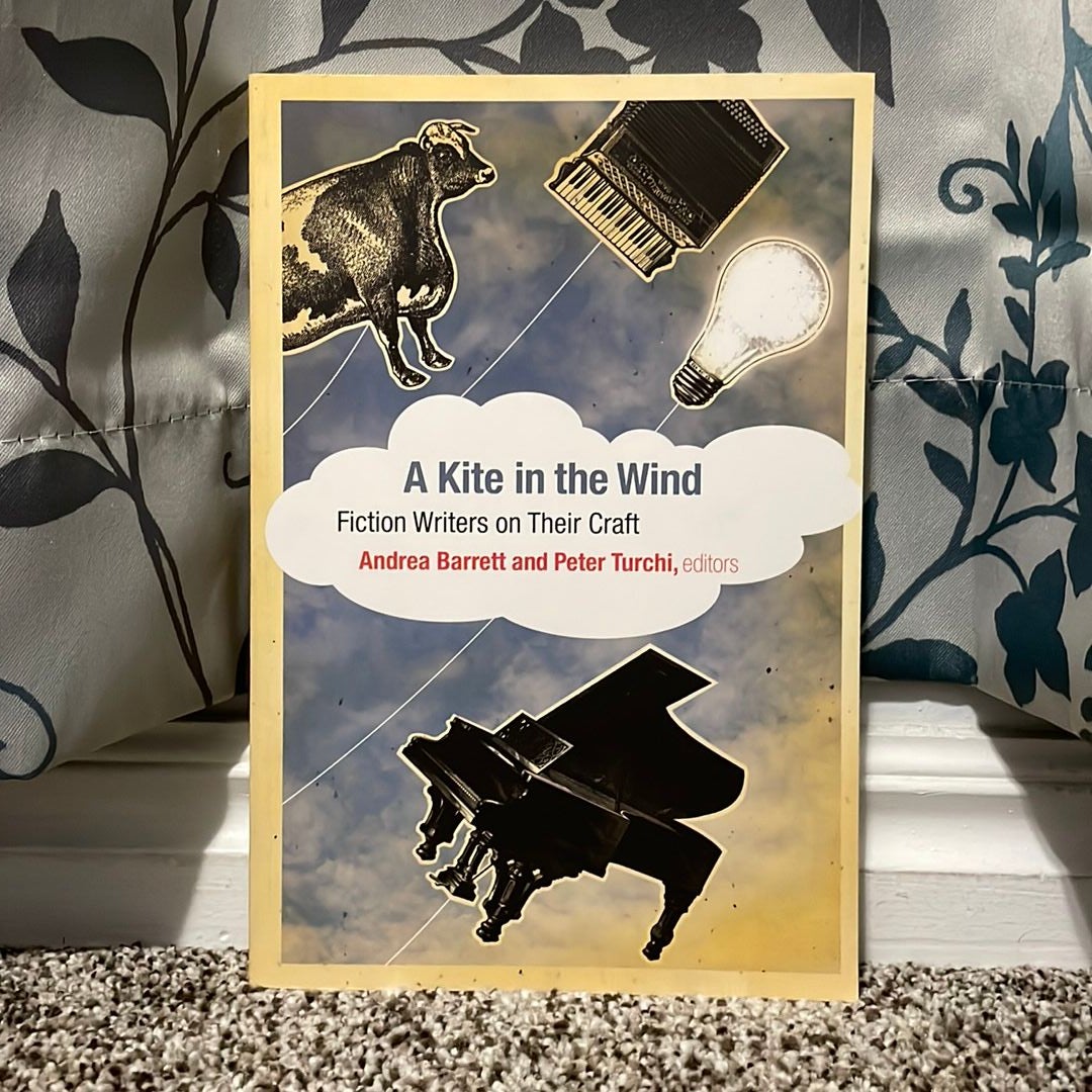 Happy Family Flying A Kite In The Wind Farm Stock Photo