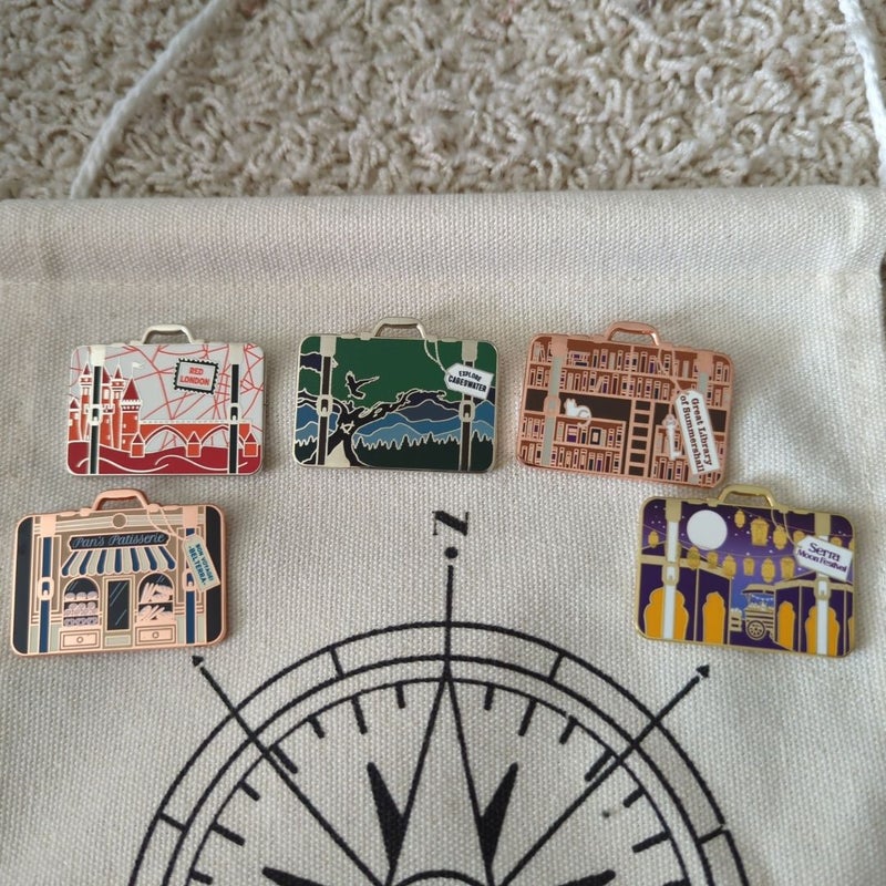 10 Owlcrate Literary Luggage Pins and banner