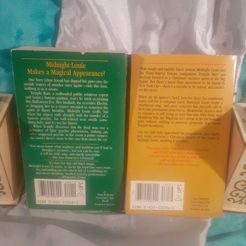2 A Midnight Louie mystery books by Carole Nelson Douglas! Cat with an Emerald Eye, Cat in a Golden Garland