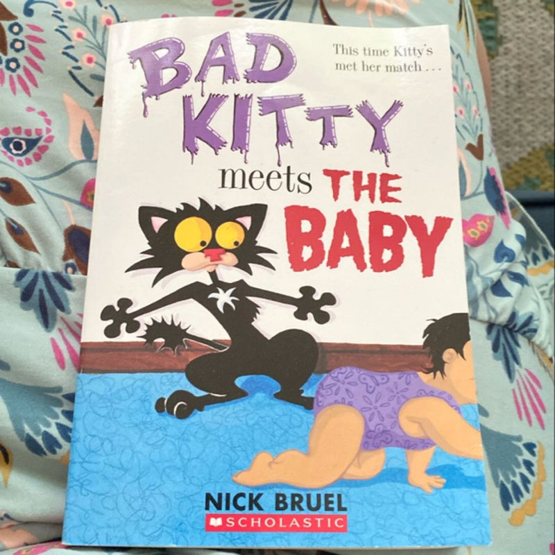 Bad kitty meets the baby