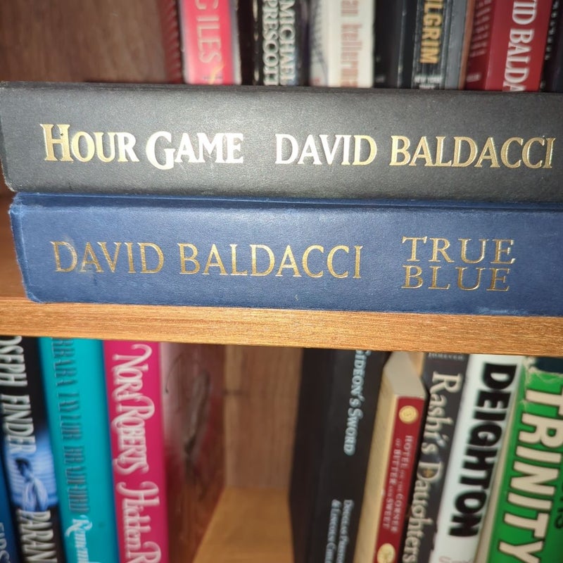 Two David Baldacci hard cover novels