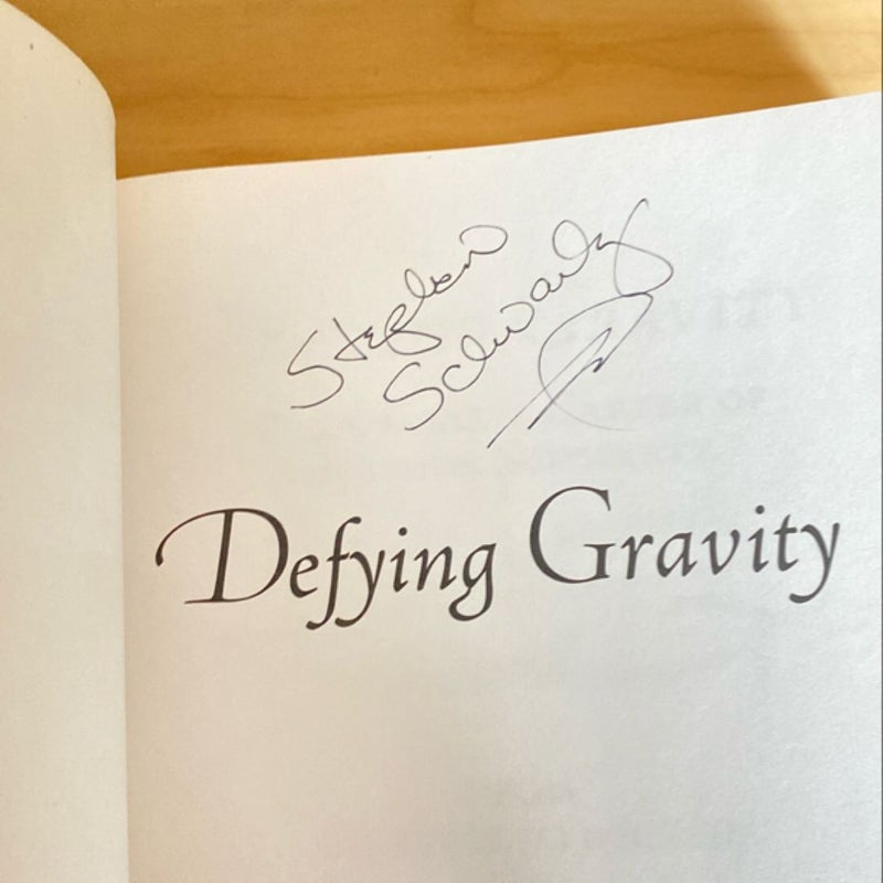 Defying Gravity Signed