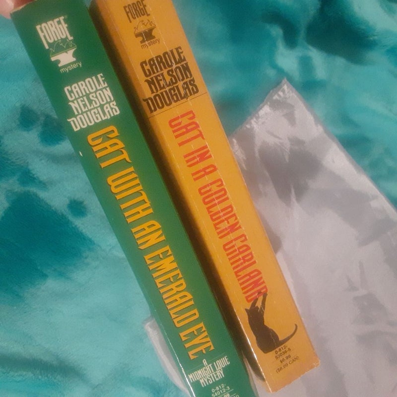 2 A Midnight Louie mystery books by Carole Nelson Douglas! Cat with an Emerald Eye, Cat in a Golden Garland