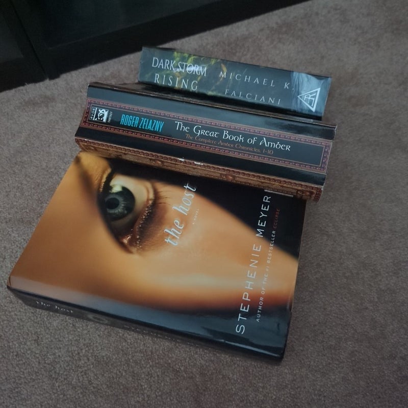 I like big books and I cannot lie bundle The Great Book of Amber , the host, dark Storm rising