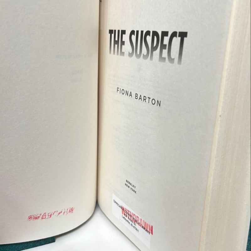 The Suspect (Ex Library Book)