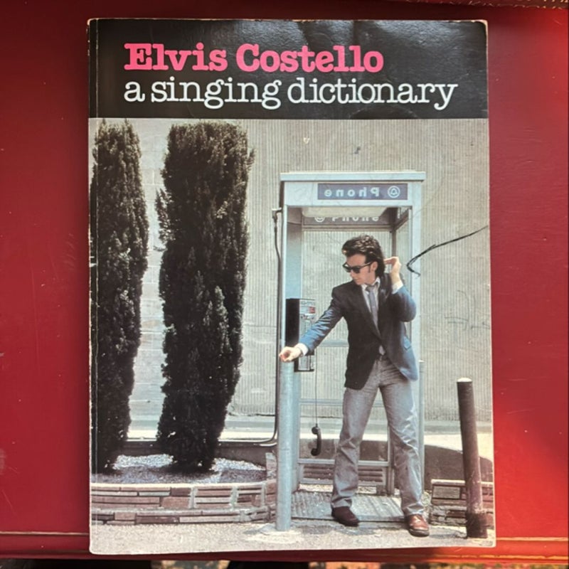 Elvis Costello a singing, dictionary