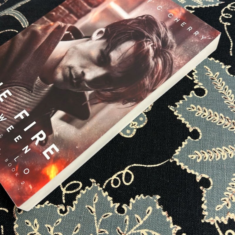 The Fire Between High and Lo (Signed)