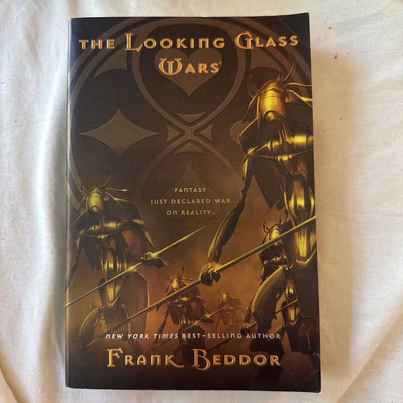  The Looking Glass Wars: 9780142409411: Beddor, Frank: Books