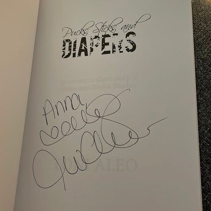 Pucks, Sticks, and Diapers (signed by the author)