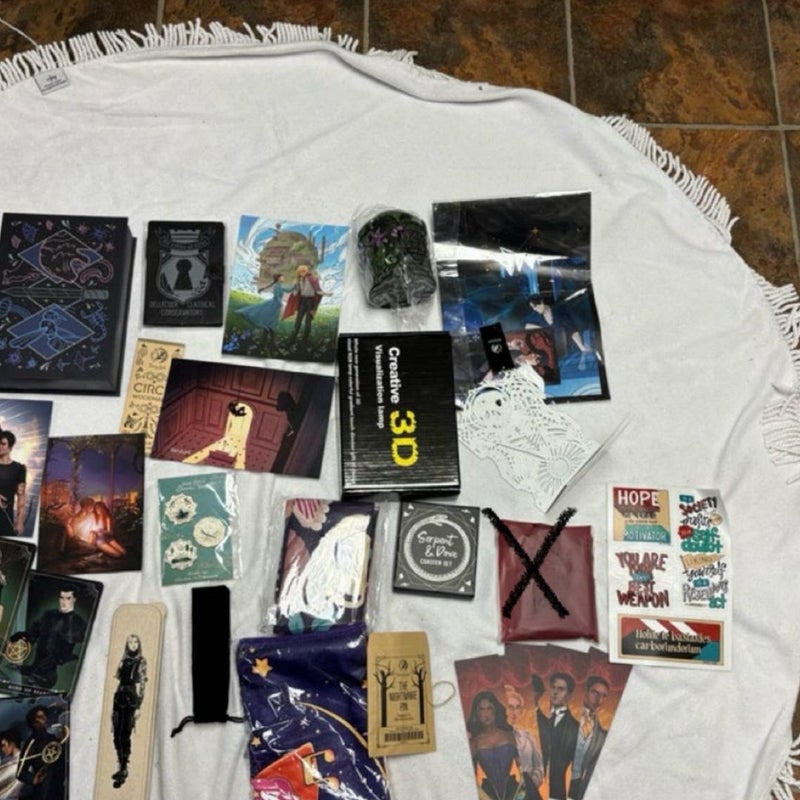 Box with 8 books and 40 goodies from Bookish box, Illumicrate, Fairyloot, Faecrate and Owlcrate. 