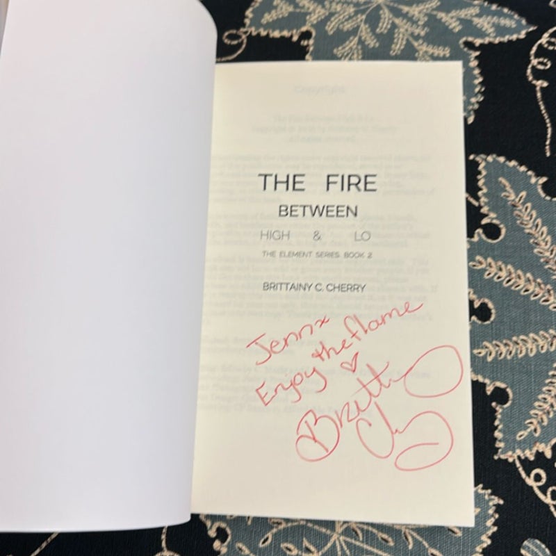 The Fire Between High and Lo (Signed)