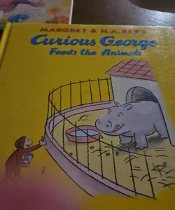 Curious George feeds the animals