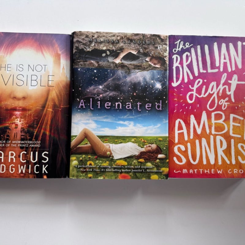 3 book lot: She is Not Invisible,Alienated & The Brilliant Light of Amber Sunrise.