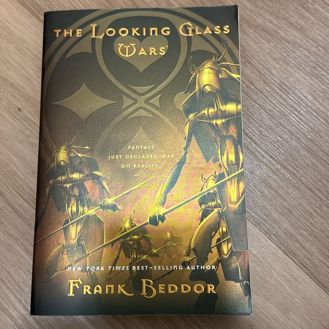  The Looking Glass Wars: 9780142409411: Beddor, Frank: Books