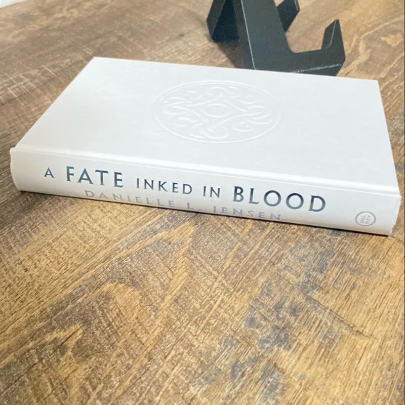 A Fate Inked in blood, EMBOSSED dust jacket with metallic sprayed edges! 1st international edition 