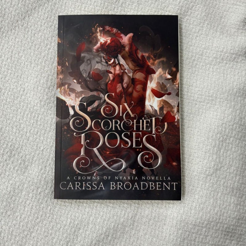 Six scorched roses